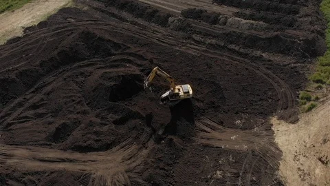 Excavator working in the field Stock Footage 89936202