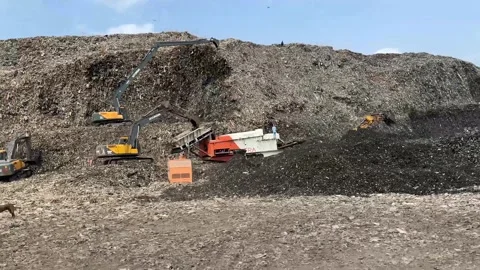 Excavator Working at Huge Garbage Disposal Site Environmental Footage. Stock-Footage 336067556