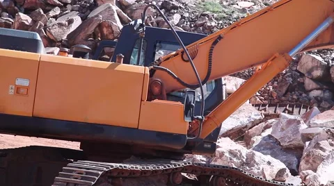 Excavator working on marble stone quarry Stock Footage 61171397