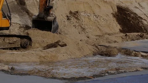 Excavator is working on a modern construction site -- slow motion Stock Footage 89918590