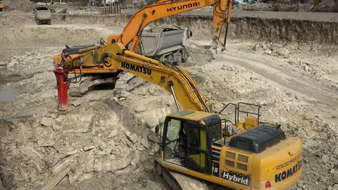 Excavator working in a new road construction 動画素材 88556326