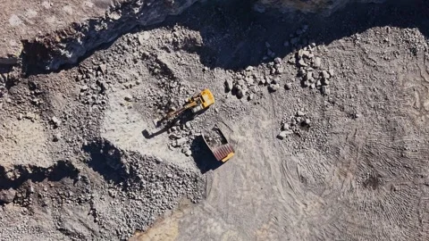 Excavator working in a quarry during daytime hours Stock Footage 344539723