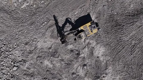 Excavator working on rocky surface at a construction site Stock Footage 344538785