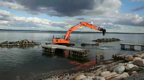 Excavator working at sea Stock Footage 840899
