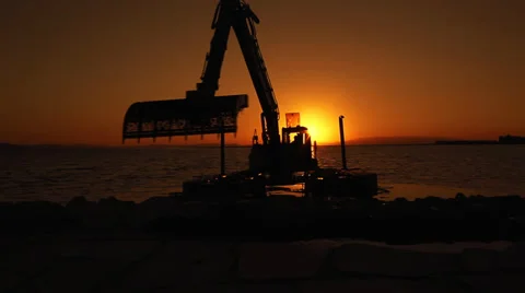 Excavator Working In The Sunset Stock Footage 36678499