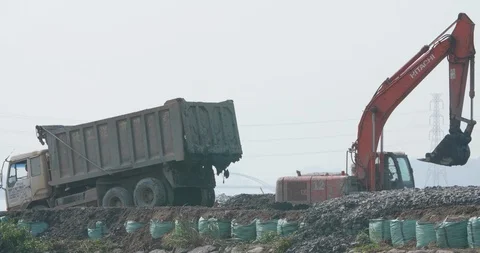 Excavator working on the Tamsui river Stock Footage 90663698
