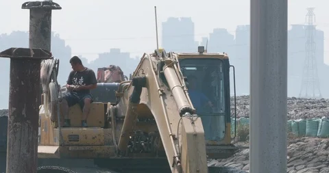 Excavator working on the Tamsui river Stock Footage 90664598