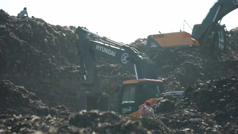 Excavator Working On Top Of Garbage Mountain At Delhi Landfill Stock Footage 248058088