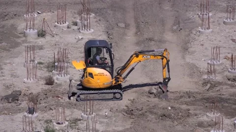 Excavator works on the construction of the foundation Stock Footage 147190461