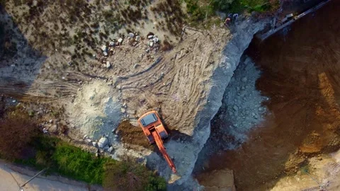 The excavator works on the land plot, levels the ground for the foundation Vídeos de archivo 227599173
