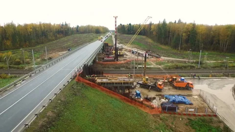 Excavators and a crane at the bridge. Construction of a new road in the Moscow Video stock 97784047
