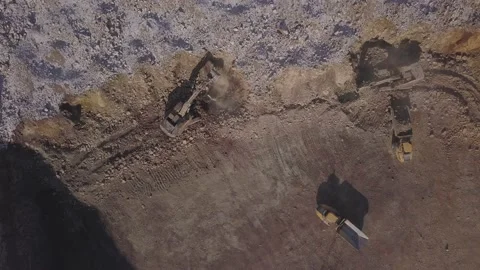 Excavators and dump trucks at work in the quarry. Static top view Stock-Footage 136184009