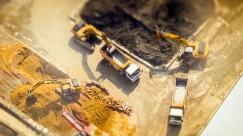 Excavators and tipper tracks at construction. Hong Kong. Time lapse, tilt shift Видео 47390837