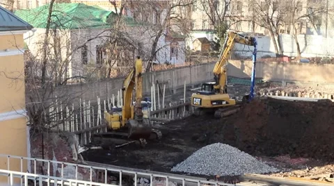 Excavators dig a ditch hole on a building constraction site Video stock 48795226