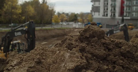 Excavators digging in construction site Stock Footage 117182561