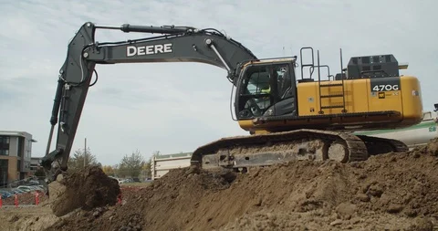 Excavators digging in construction site Stock Footage 117182777