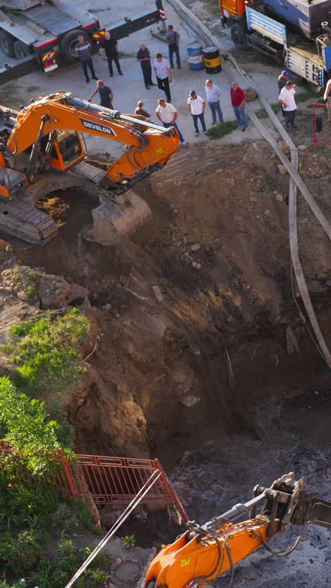 Excavators digging pit during sewer collector emergency repair Novosibirsk Stock-Footage 347166575