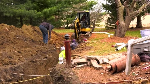 Excavators install underground pipes  P5 01610020 Video stock 157128384