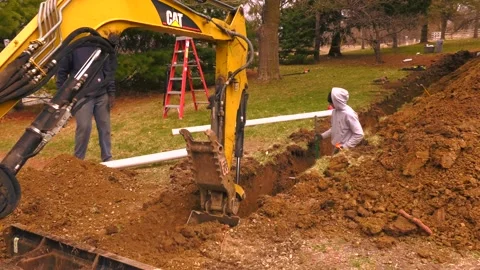 Excavators install underground pipes P5 01610036 Stock Footage 157128465