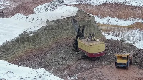 Excavators load ore into dump-trucks. Stock Footage 63545256