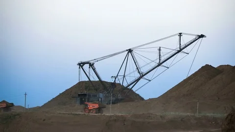 Excavators load ore into dump-trucks. This area has been mined for buaxite Vídeos de archivo 75579456