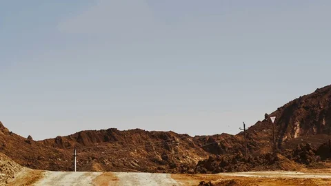 Excavators load ore into dump-trucks. This area has been mined for buaxite Vídeos de archivo 75584318