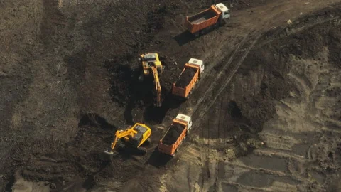 Excavators loading dump trucks Stockbeeldmateriaal 212631844