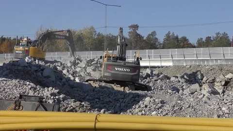 Excavators moving rocks Stock Footage 97899165
