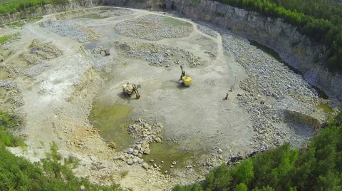 Excavators in a quarry. Aerial view. Camera around Stock Footage 49835545
