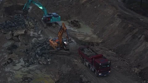 Excavators working on demolition site at dusk. Aerial drone view Stock Footage 334550286