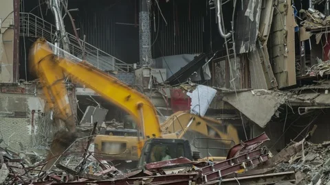 Excavators working on the wreckage of the building, time lapse Stock Footage 121128545