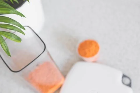 Excellent blurred light kitchen background with a container for bulk, a Stock Photos