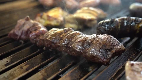 Excellent cut of meat burning on the grill Stock Footage 204422955