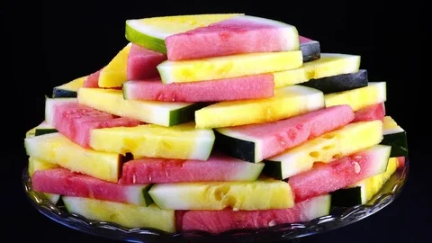 Excellent heap of fresh red and yellow watermelon in triangle pieces Stock Footage 84074348