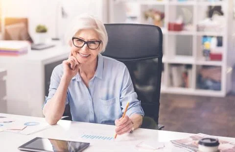 Excellent professional executive studying the performance data Stock Photos