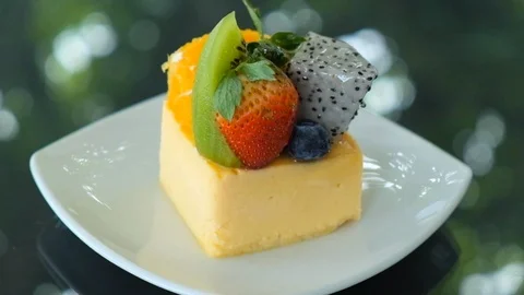 Excellent side-view of round pie with sliced fresh strawberries and kiwi-frui Stock Footage 95596423