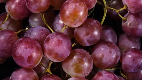 Excellent top view of bunch of grapes, rotating against the clock Stock Footage 74694024