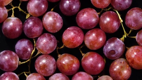 Excellent top view of grape berries with stems, rotating against the clock Stock Footage 74694170