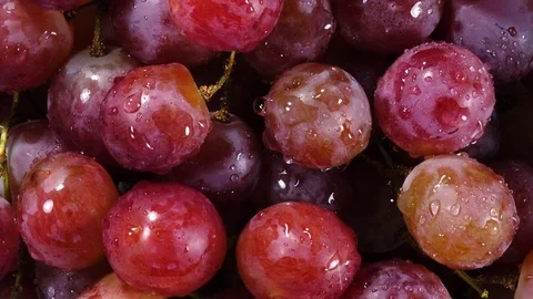 Excellent top view of grapes close up, water sprinkling and rotating Stock Footage 76964648
