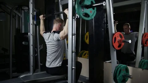 Excercise for delts on smith machine Stock Footage 76168240