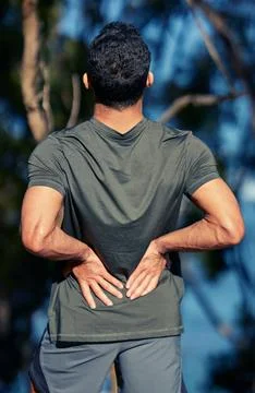 Excess physical activity can cause muscles to stretch too much. Rearview shot of Stock Photos