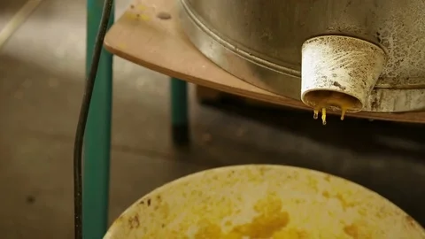 Excess wax is dripping from a steamer Stock Footage 74056683