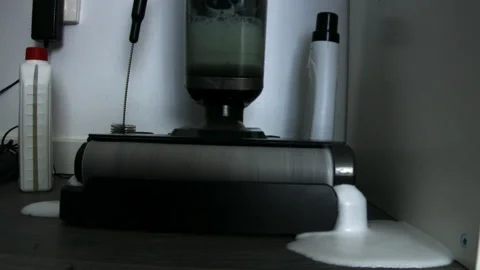 Excessive Foam Overflow From Self-Cleaning Vacuum Mop Stock Footage 341930795
