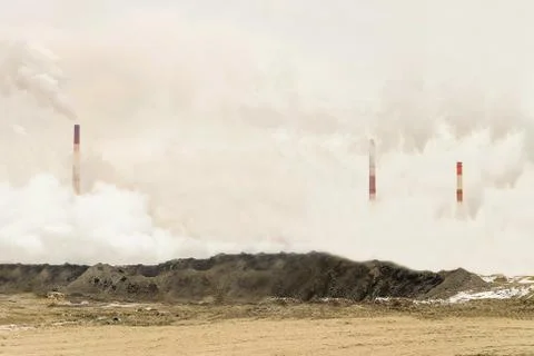 Excessive pollution of the environment. Dense factory. Stock Photos