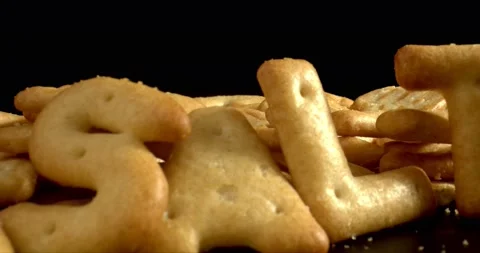 Excessive salt intake concept. The word SALT written with crackers. Crackers on Stock Footage 146734238
