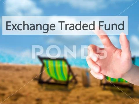 Exchange Traded Fund - Hand pressing a button on blurred backgro Stock Photos