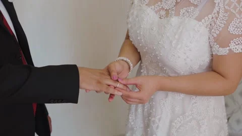 Exchange Of Wedding Rings.The bride and groom exchange rings at the wedding. Stock Footage 160385612