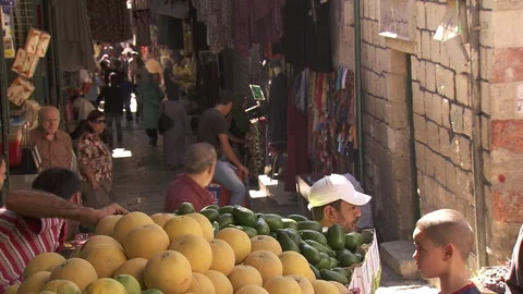 Exchanges at fruit stand in Jerusalem market Stock Footage 86759573