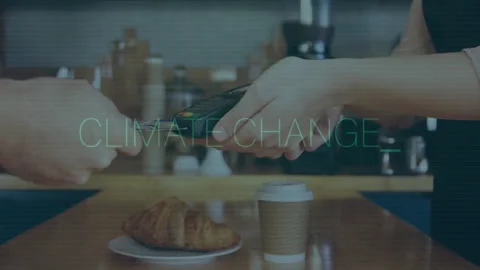 Exchanging credit card over coffee and croissant, reading Climate Change Vídeo Stock 304011748