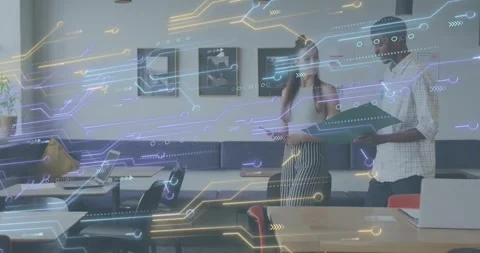 Exchanging looks and discussing report, colleagues walking through tech office Stock Footage 318093443